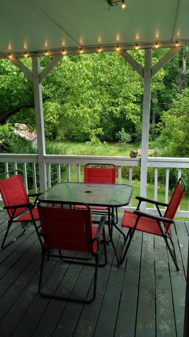 Covered porch with patio furniture ready for your use!