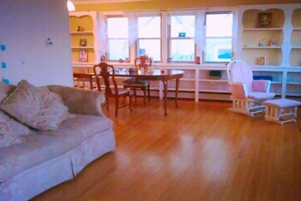 Dining area and living room with futon and TV