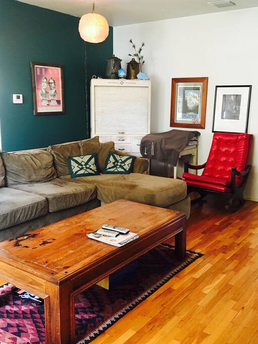 Sunny living room with hardwood floors.