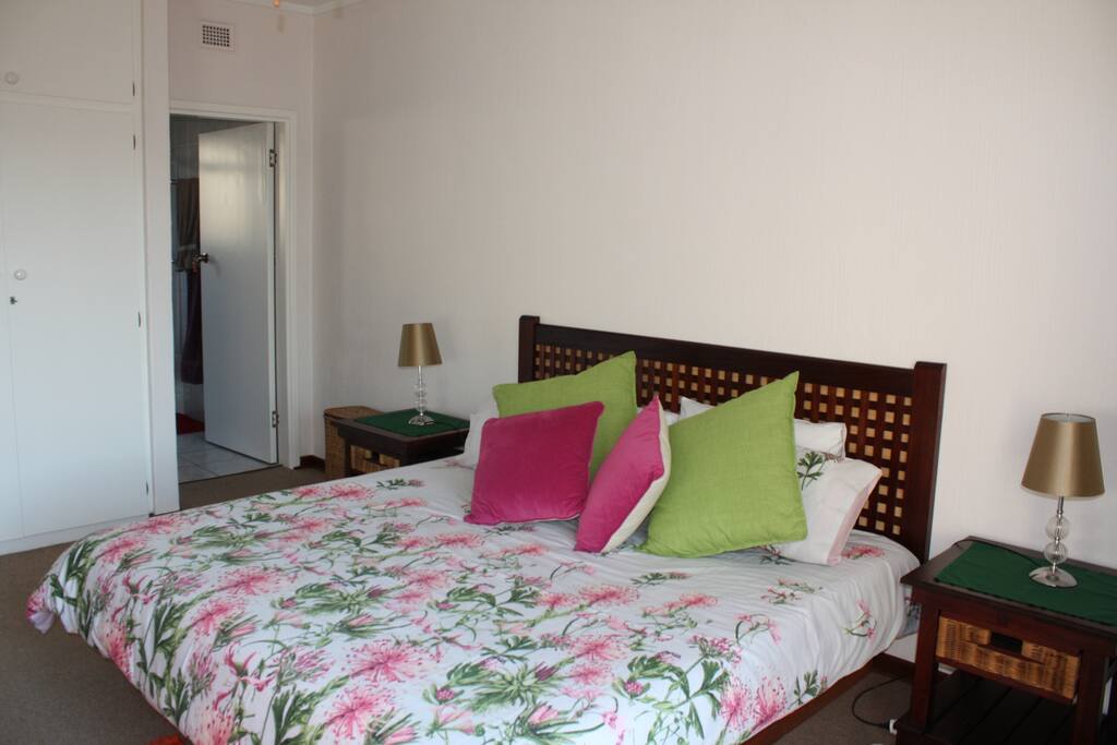 Main bedroom king size bed and en-suite bathroom