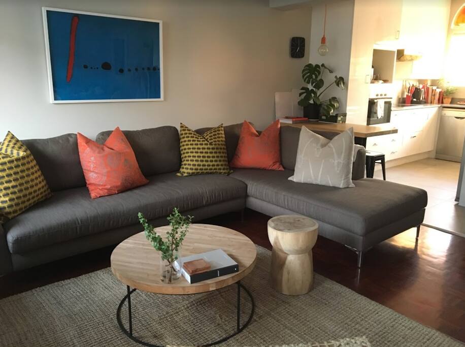 Comfortable lounging area with kitchen in the background