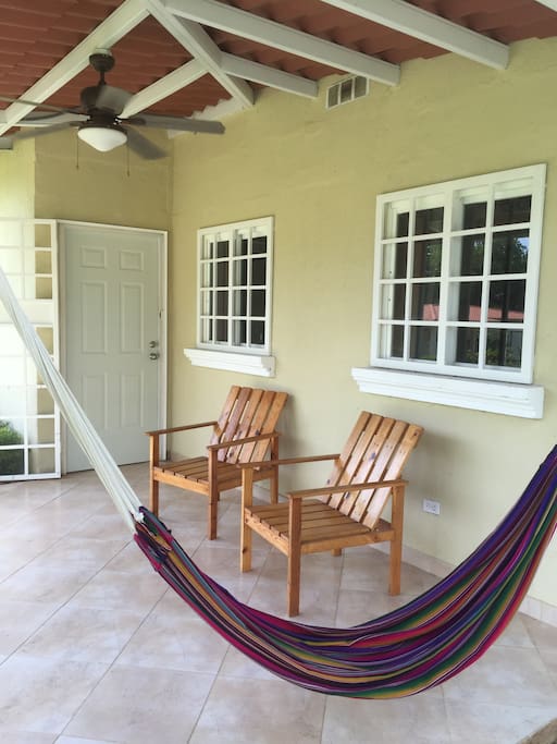 Comfy entrance/terrace with nice view of the garden and court.