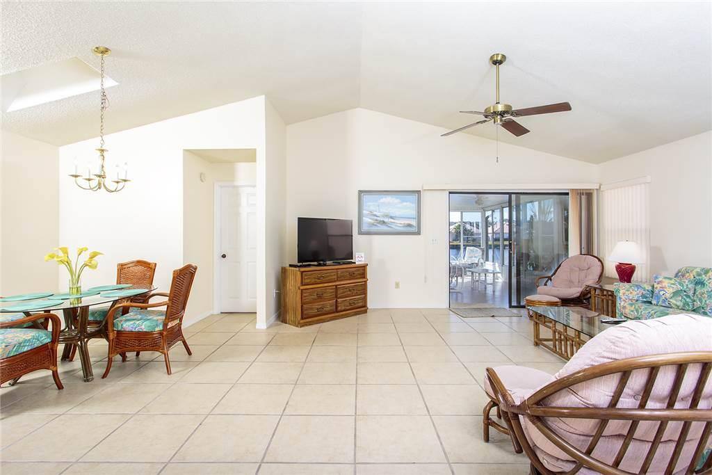 The spacious living room and lanai overlooking the water! - Stretch out and get comfortable at Sea Place! This big living room wi