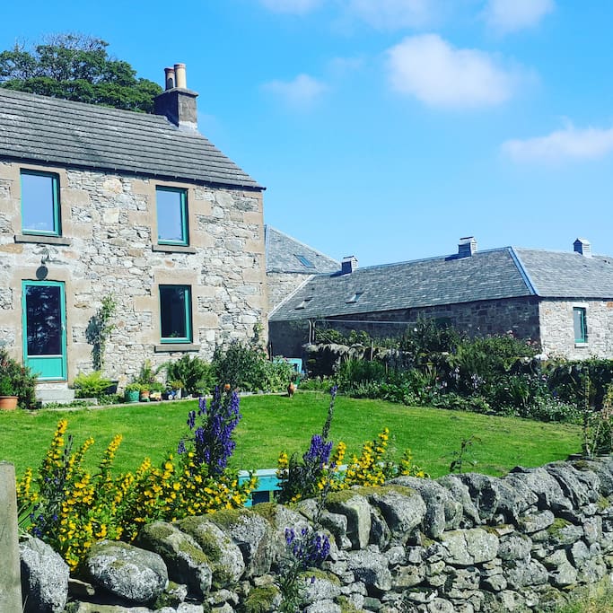 Our house is on the left and the steading is on the right where you will stay