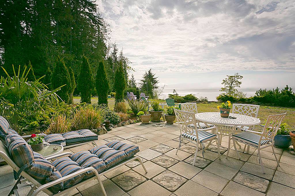 Patio in front of cottage.. Dine in or out .. Gas barbecue is provided.