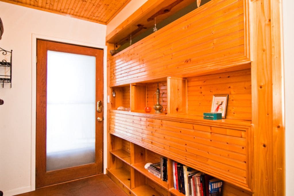 Knotty pine shelves for shoes and books - take off your shoes and rest!