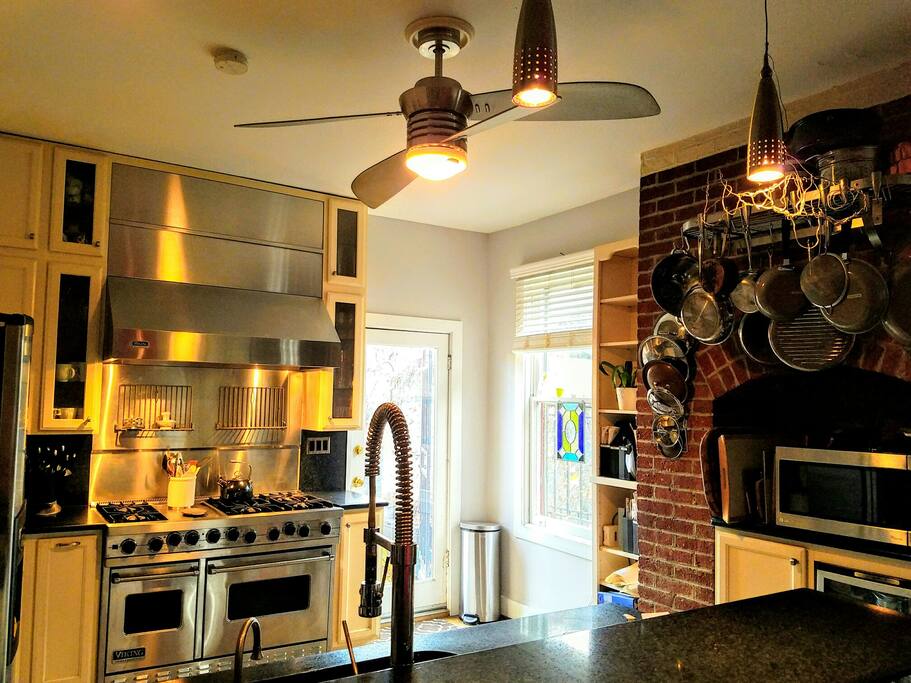 Viking six-burner range with a griddle. Nothing like it. Kitchen has everything you need to host a dinner party. Or just enough to have coffee and snacks in between D.C. events. The counter with seating for four lets the cook hold court.