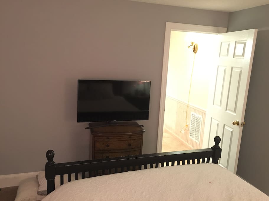 Large flat screen smart TV with remote
