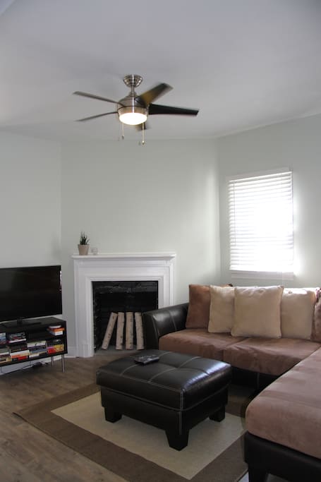 living room: couch, HD TV, Xfinity DVR cable box.