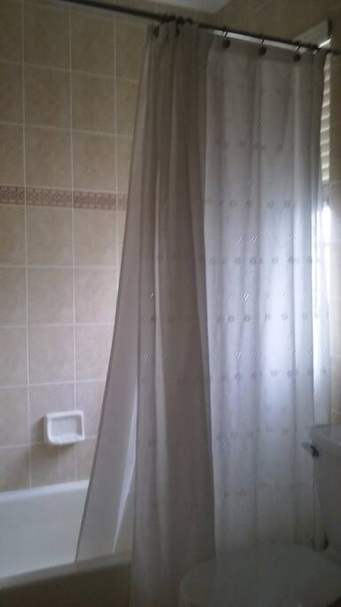Private bathroom with shower.