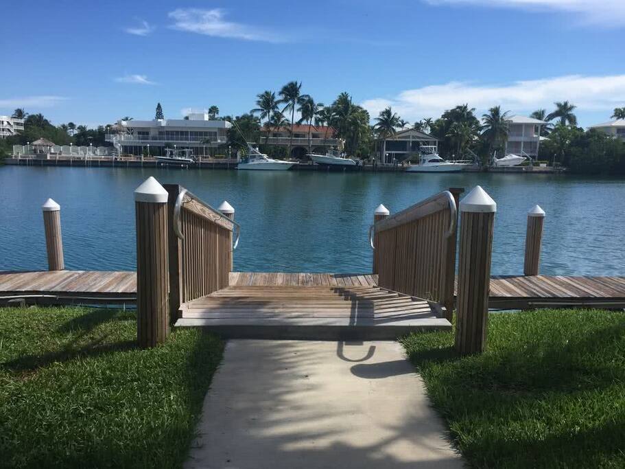 35` Dock is Slip 127 at the bottom of these stairs next to 7050 Harbour Village Drive