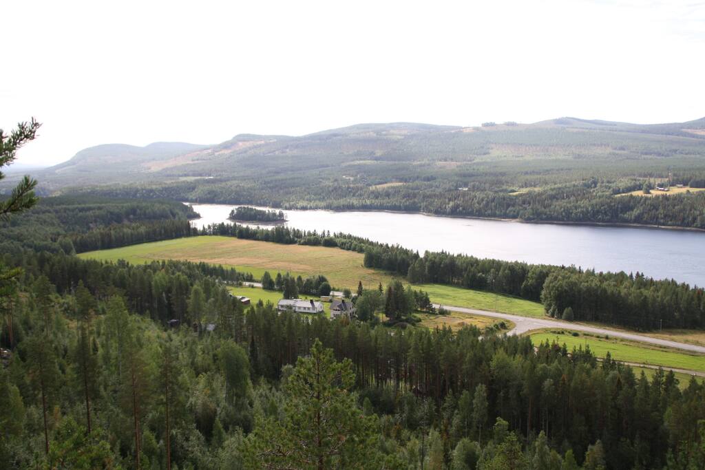 The view from the Bredsel hill, overlooking the house and the Pite River Valley. The road to the right is a 10 minute walk to the Storforsen Hotel.