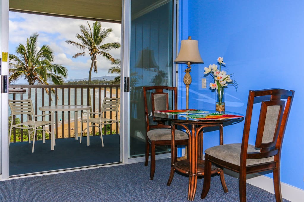 Dining area inside and out with view of Wailua Bay.