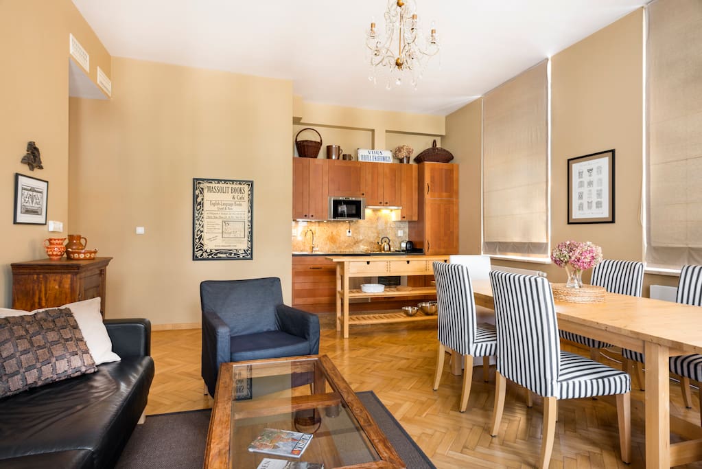 View of kitchen/dining area featuring granite floors and countertop.