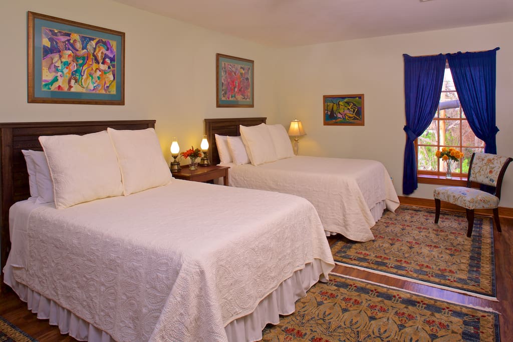 Around the Corner's has two bedrooms on the second floor -- including this one with two Queen beds.