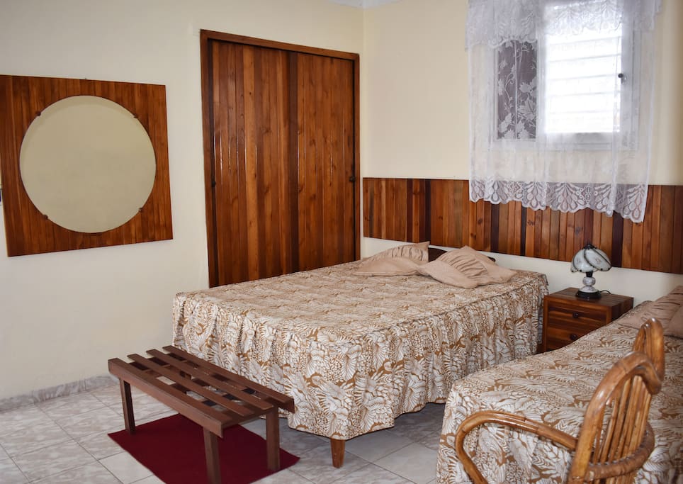 Bedroom with private bathroom, air conditioned and fridge.
