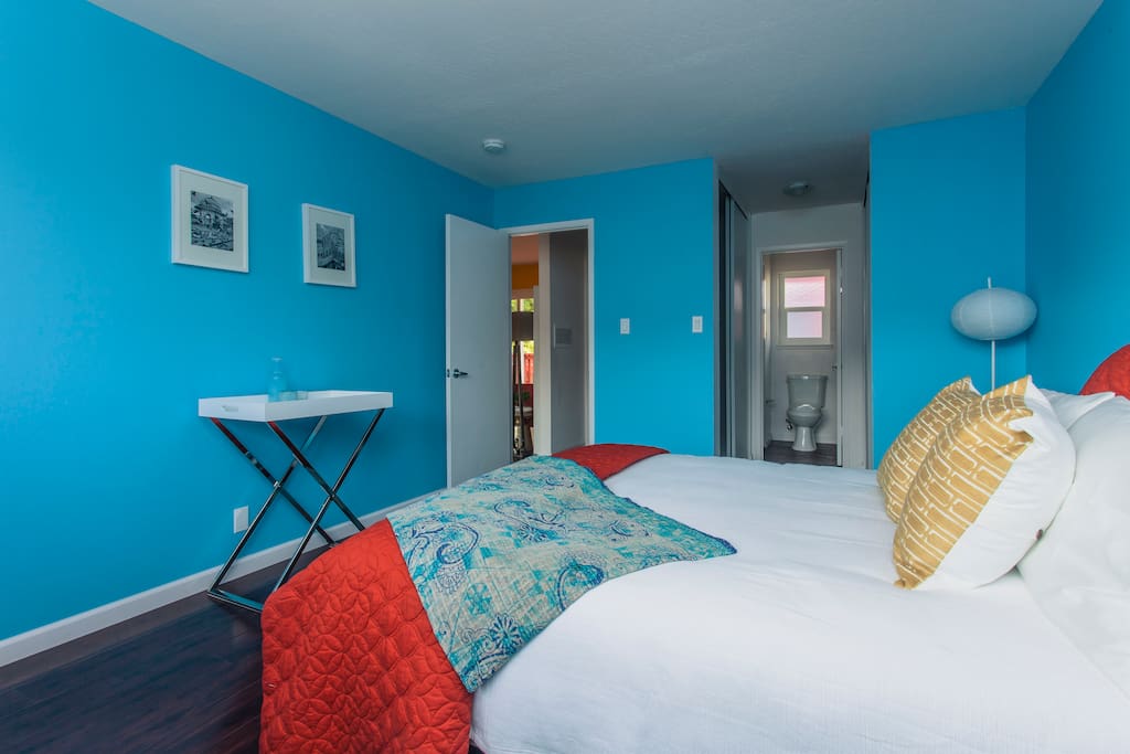 Here you can see the entry way to the bathroom with a rainforest style shower (not visible in the picture). The entryway to the bathroom, there are 2 closets with built in shelving and hangers to keep you organized during your stay!