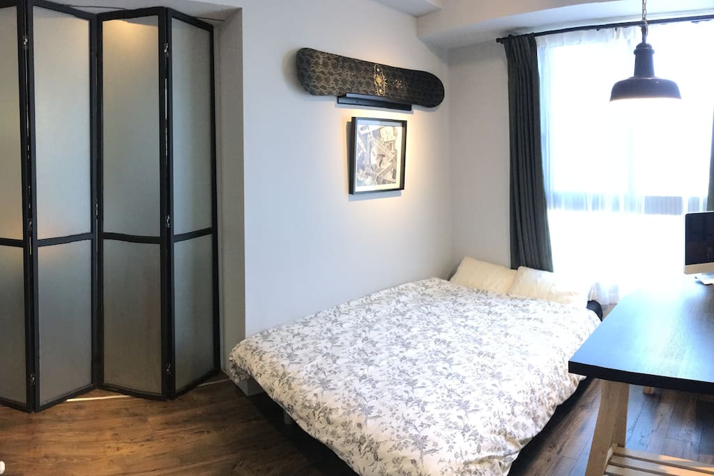 Cozy bedroom with large windows