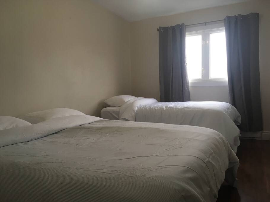 Second bedroom with queen and twin beds