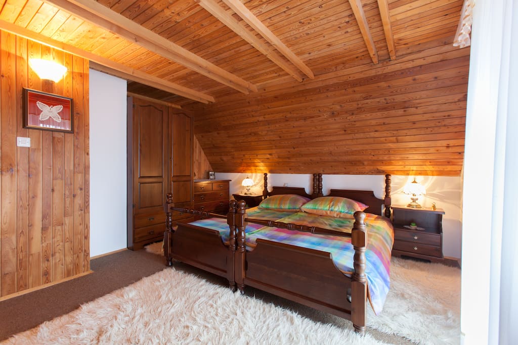 Master bedroom for two. Brighter in airy. With exit to balcony with view to Cerknica Lake.