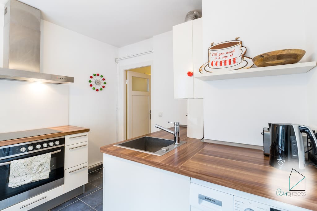 The modern and bright kitchen is fully equipped and invites you to cook delicious meals with your friends.