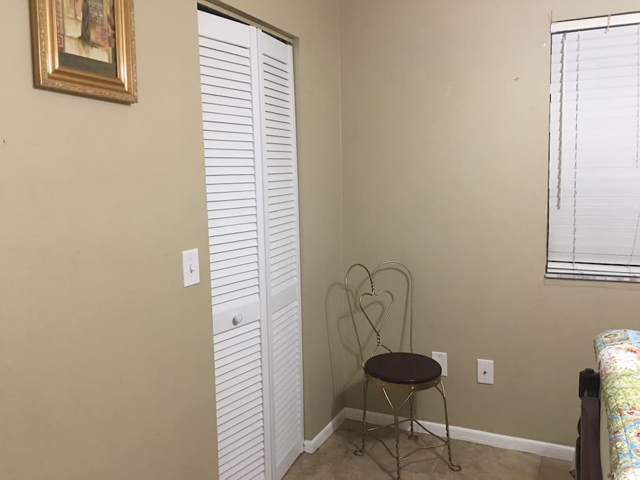 The walk in closet to the left and the chair to the right