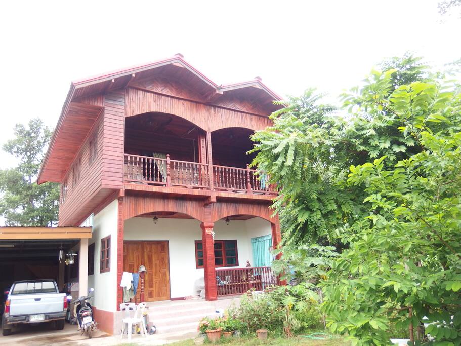 a wooden house with fresh natural air, at the terrace looking at stars at night
