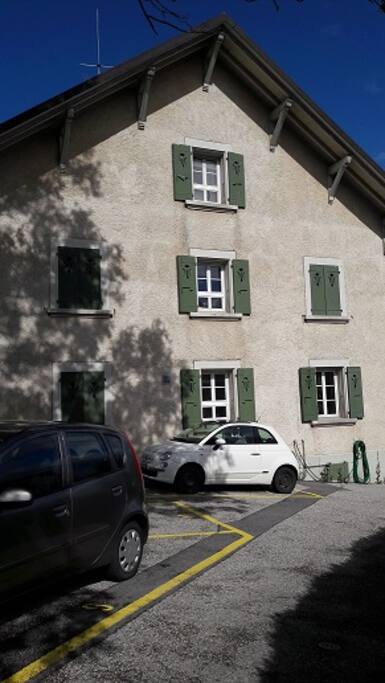 Side view of the house from the driveway. You can park behind my white Fiat, in parking space # 11.