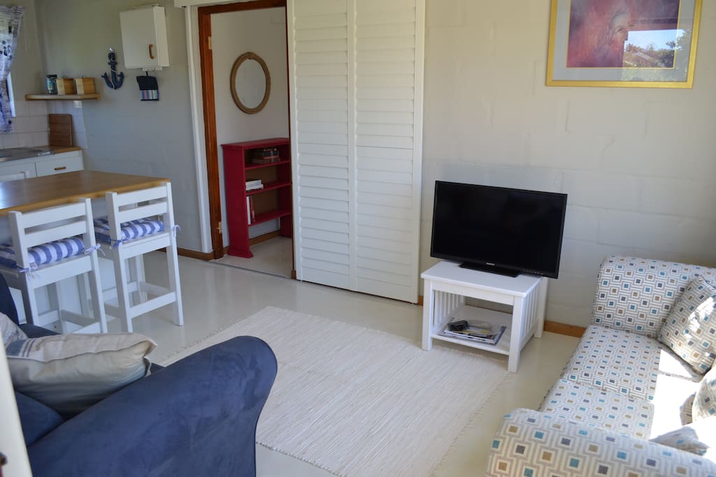 The lounge and small kitchen are fully equipped and suitable for a couple