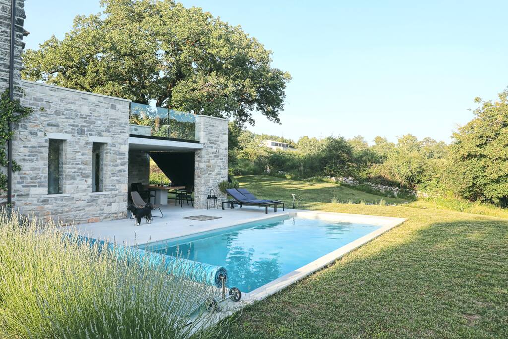 The house set in a garden with its own private pool and overlooking the countryside