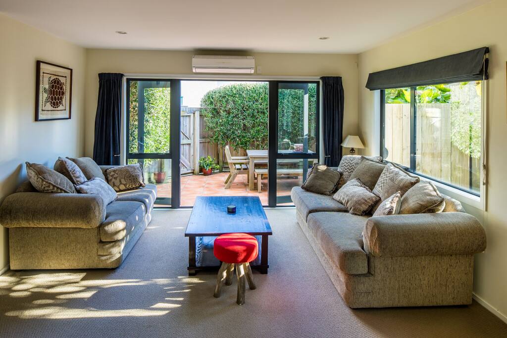 Formal living area opens out to the private, sunny courtyard