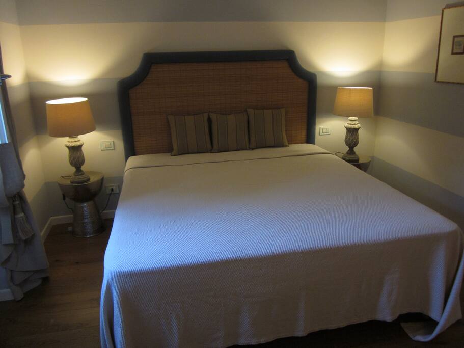 A spacious bedroom with A/C