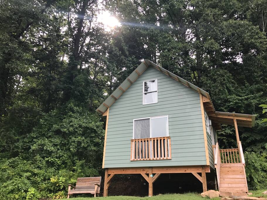 The cabin sits on a sloping hill, also called a bluff. This building site was chosen by E.W. Grove properties as one of the best in the neighborhood in the 1920s when the area was first developed.
