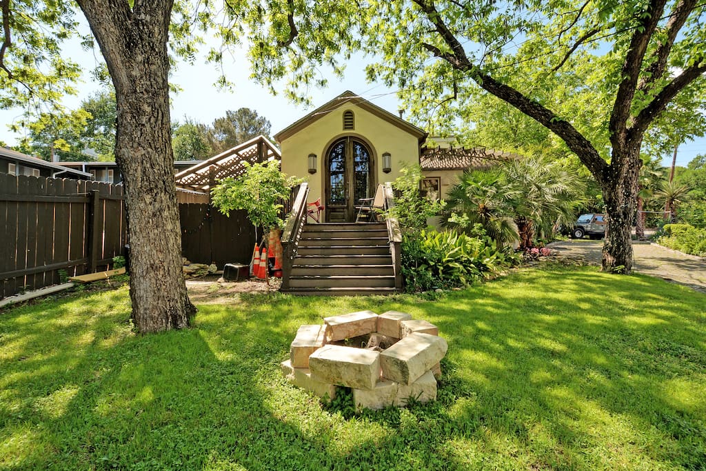 Outdoor fire pit and Texas charm in the shaded yard.
