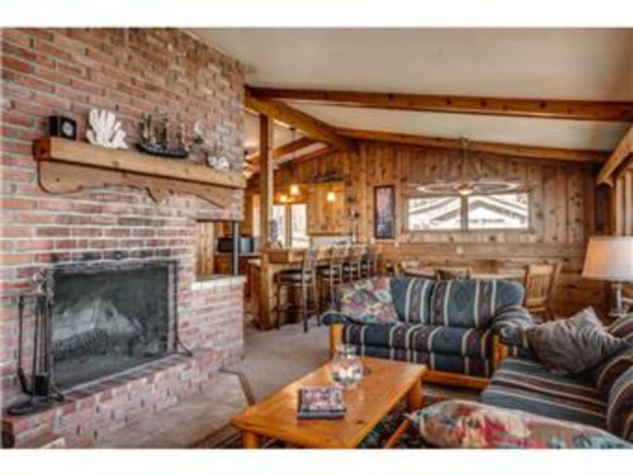 Living room area with wood burning fire place