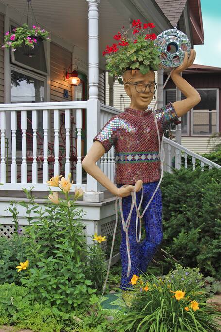 This is "Bobb". He greets all guests, holds a bobbin of lighted thread to show you the way at night, and watches over the gardens.