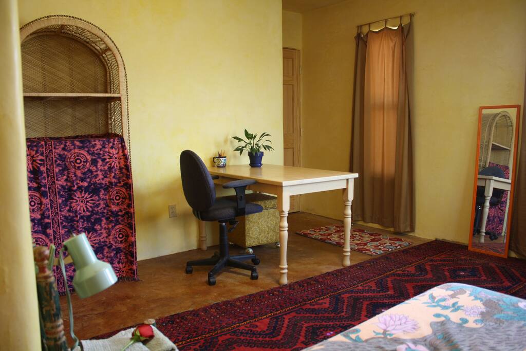 Guest room has ample desk space and shelving