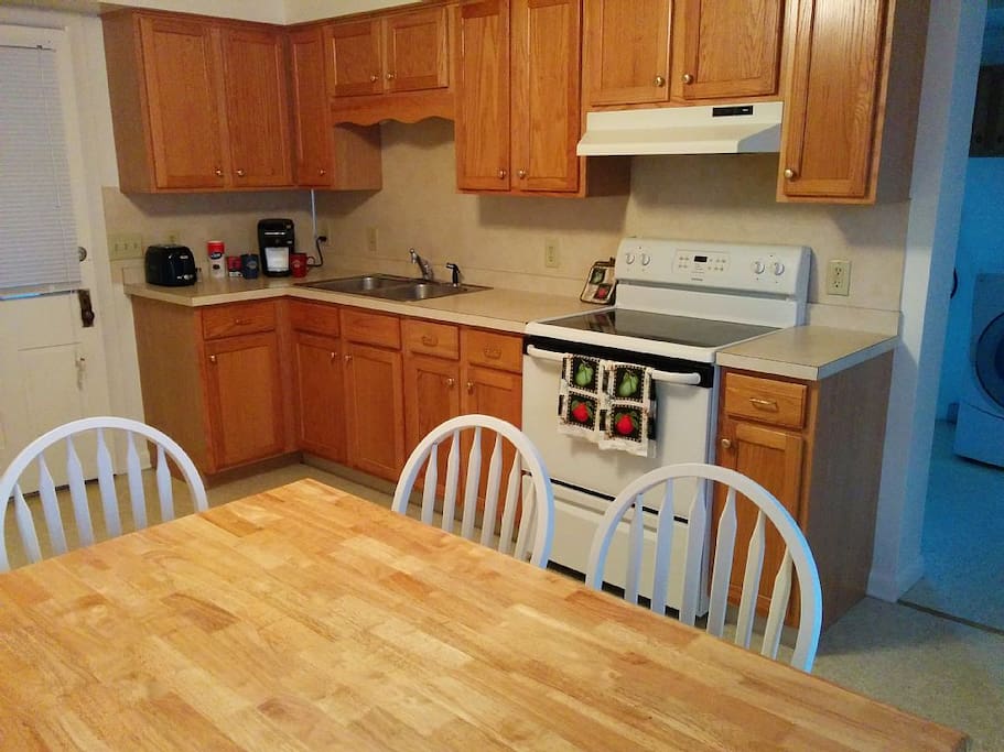 Kitchen and Laundry room with half bath behind.