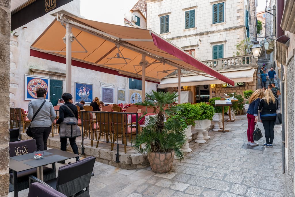 Located in Domino street, numerous restaurants among ancient traditional stone houses...