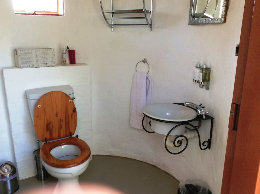 Small rondavel with Toilet and Basin accessed via a private courtyard.