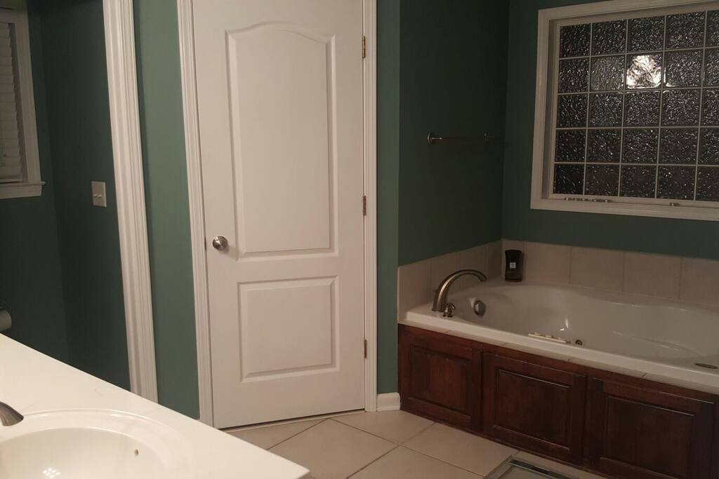 Master bathroom with double sinks, double closets, stand up shower, and jacuzzi tub!