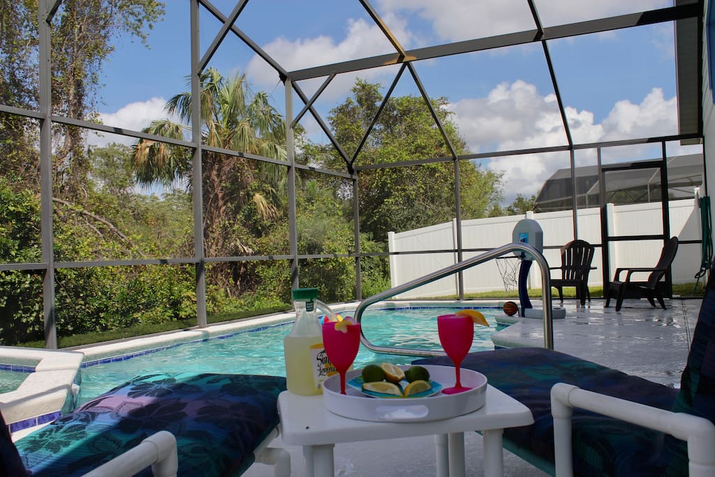 A private pool and spa with a relaxing view of the natural surroundings.