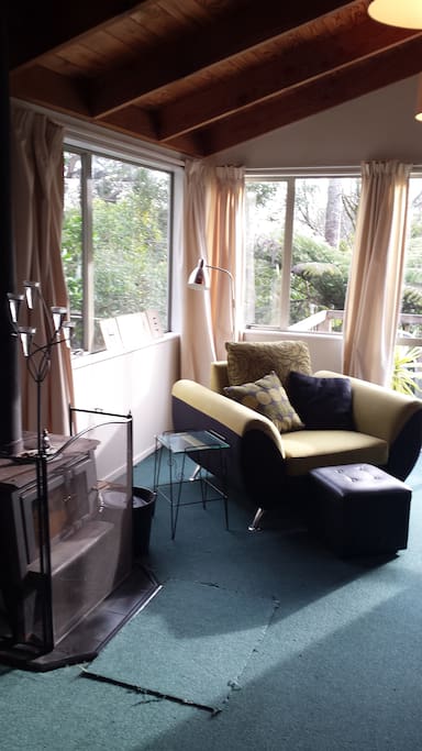 Big comfy armchair close to the fire perfect reading spot.