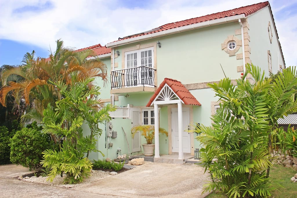 The entrance to the townhouse in a gated neighborhood with space for one car