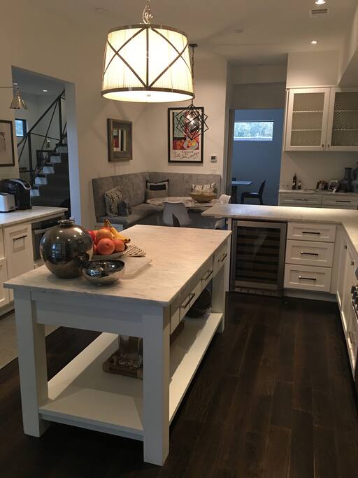 Full kitchen with sleek and modern appliances.
