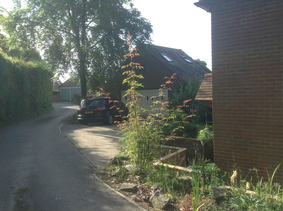 4 Parking spaces, 2 in front of garage and 2 behind