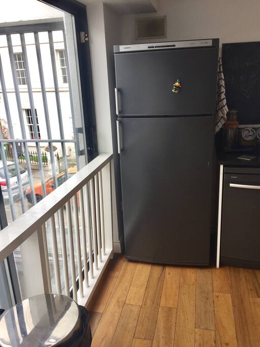 Kitchen with view of patio and the street