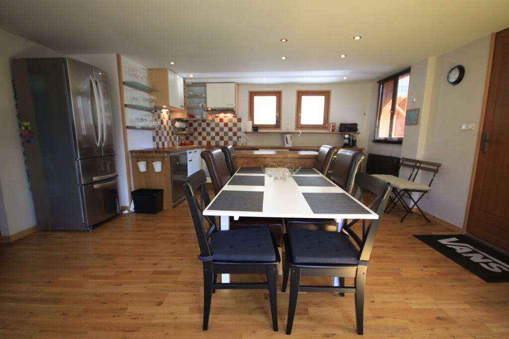 The dining table can seat 6 people with another 2 at the centre bench