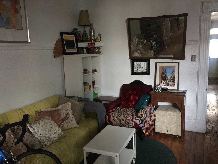 Living room with view toward front door hallway