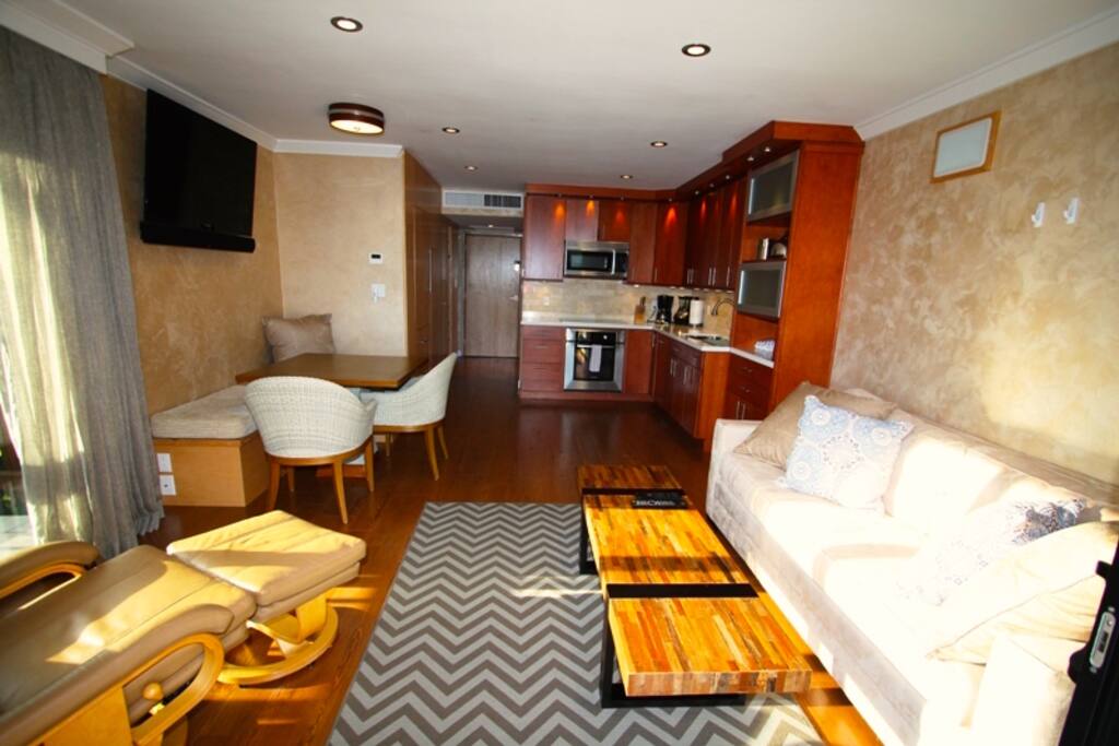 Main living area has a lot of open space with the furniture layout